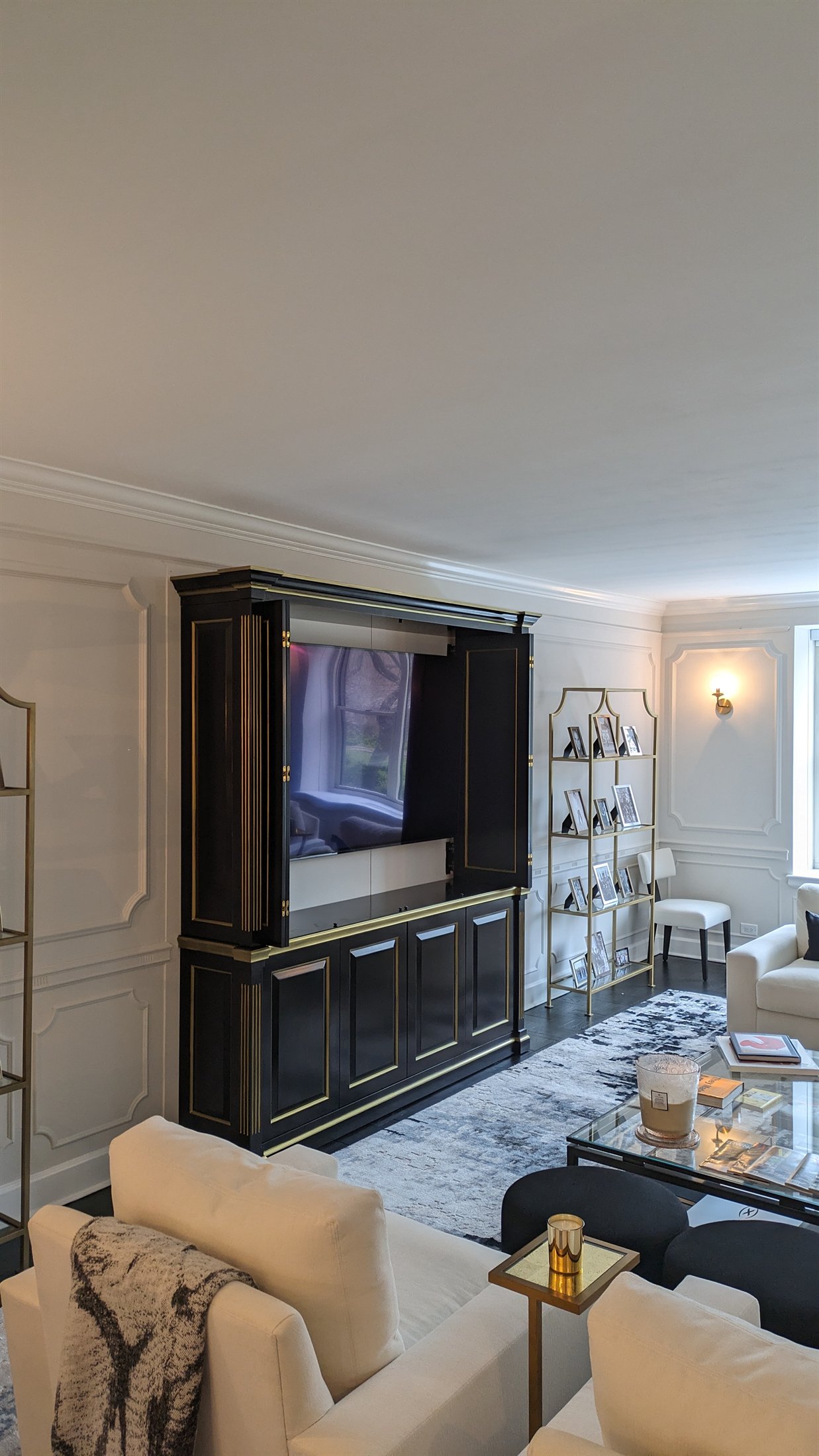 Black custom media cabinet with gold trim